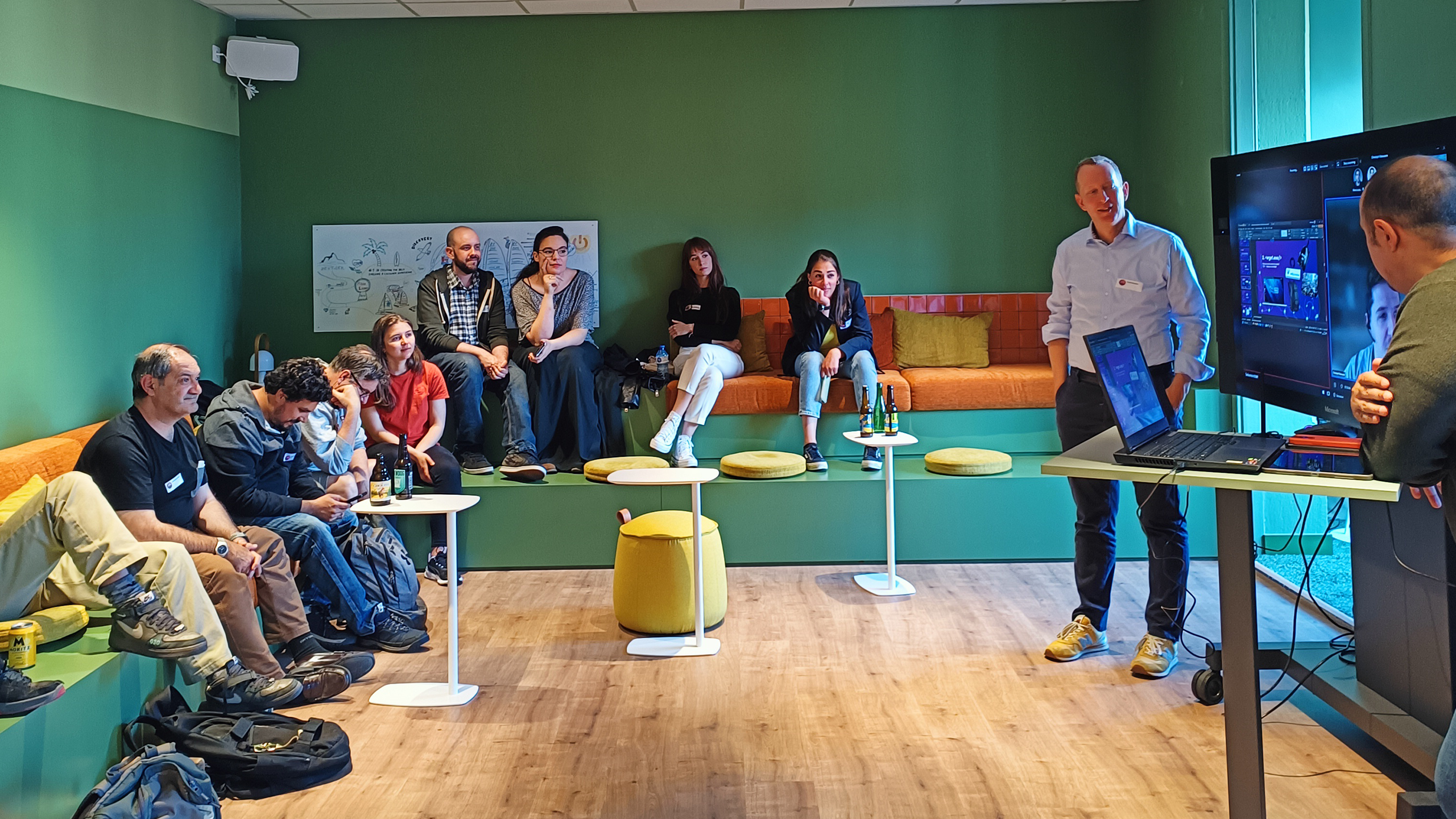 Group of people listening to speaker in the front
