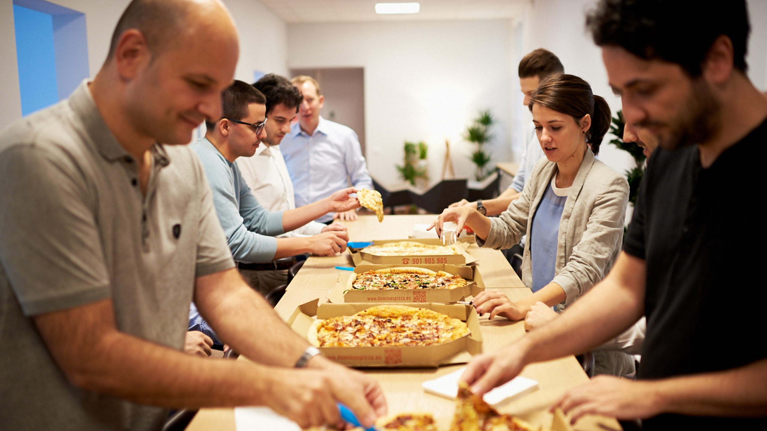 Group of people having pizza