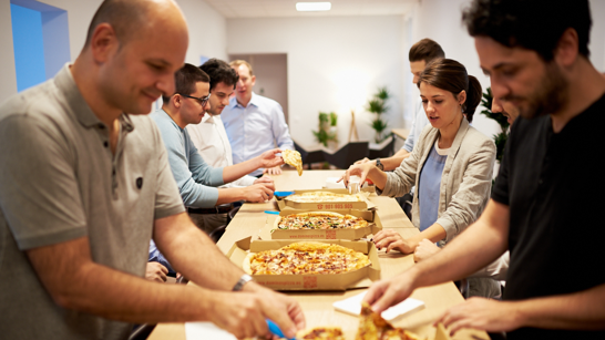 Group of people having pizza