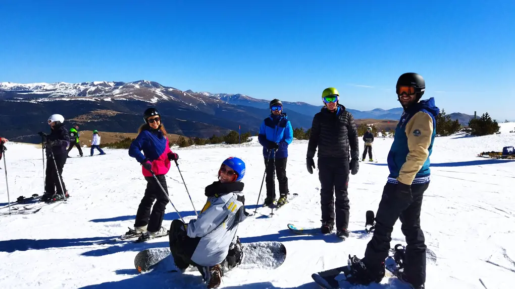 Group of people in the snow wearing ski gear