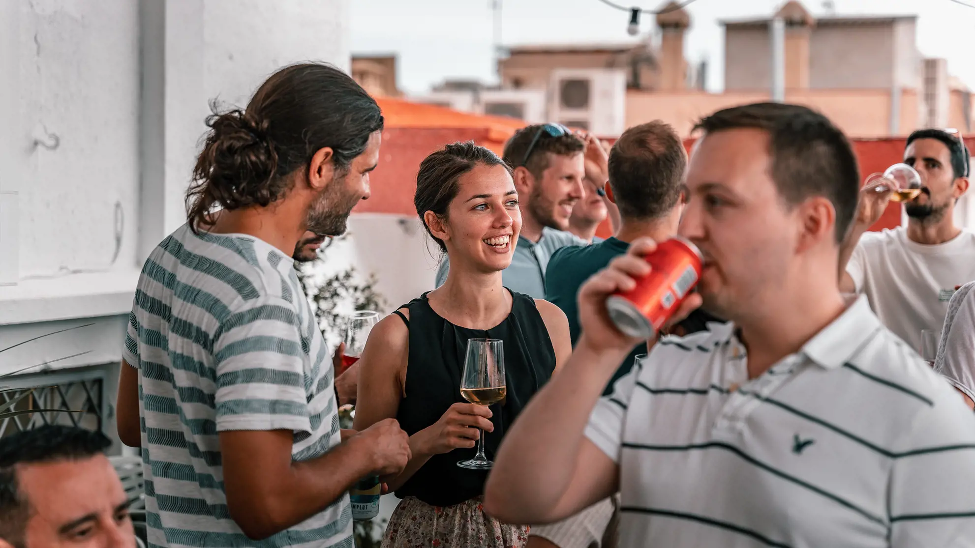 Employees during an after-work event on the rooftop terrace