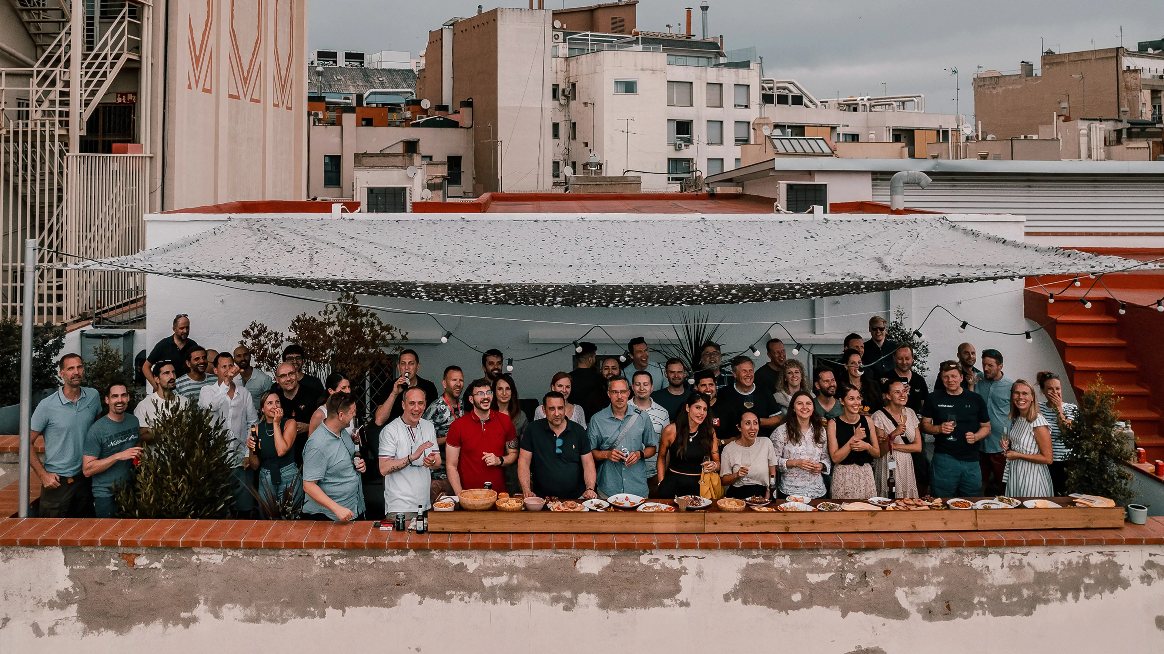 Picture form the sky of group of people on a rooftop terrace