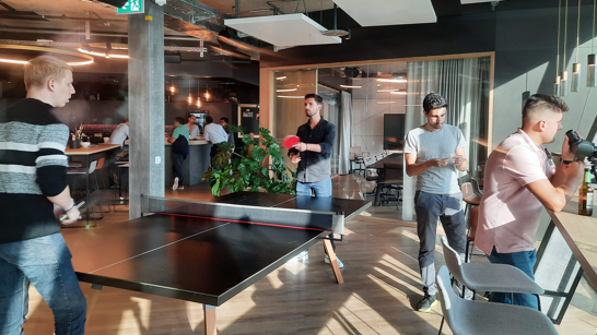 Playing Ping Pong in the Zurich office Employees playing ping pong