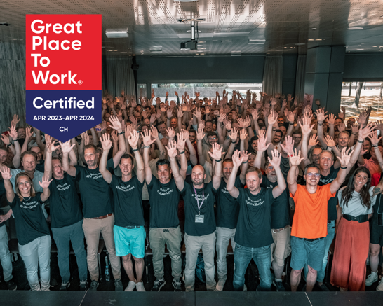 Great Place To Work Big group of people raising their arms