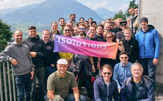 Team picture with the mountains in the background