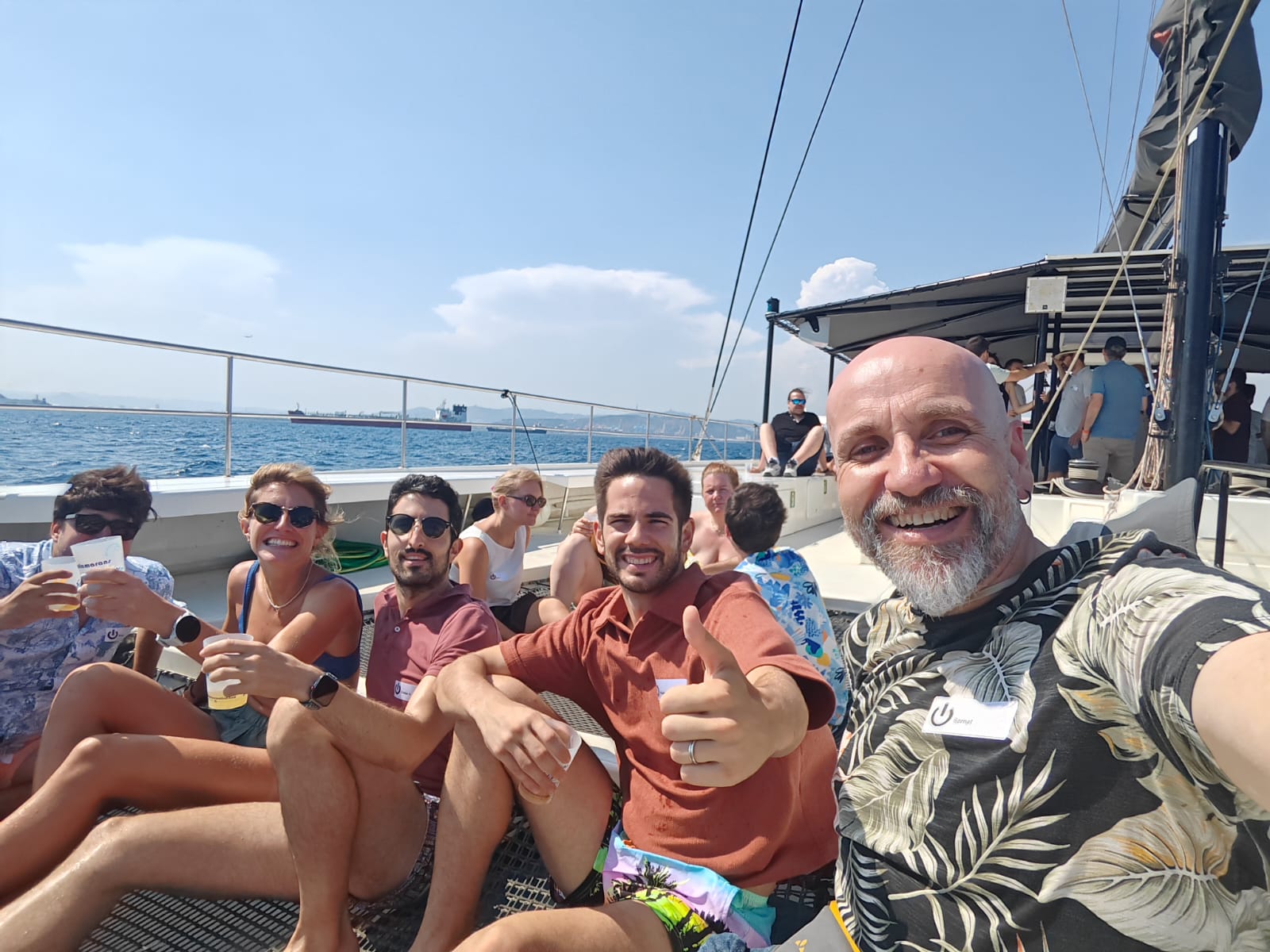 Team enjoying drinks together on a boat trip at sea