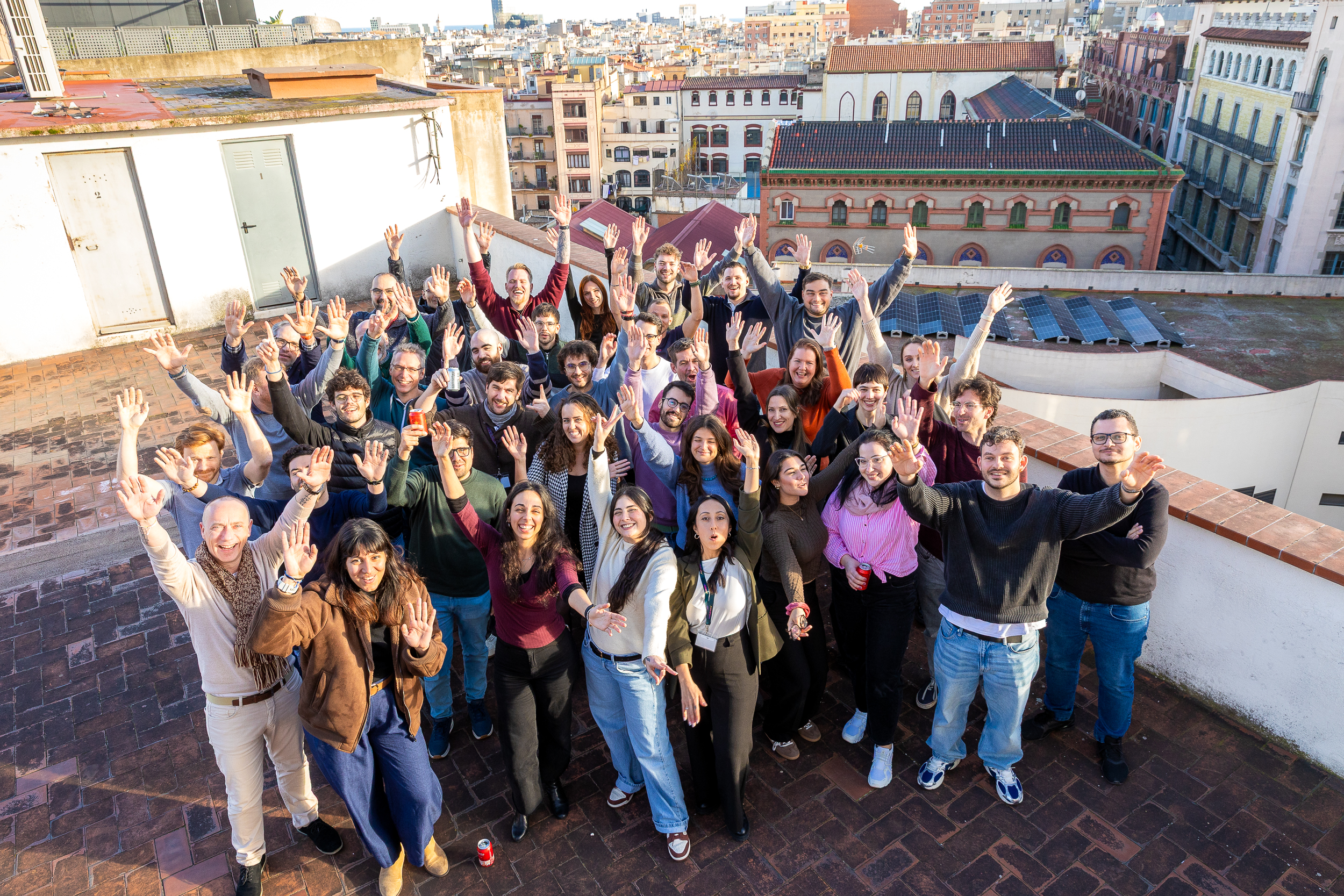 Group of enthusiastic coworkers on a terrace