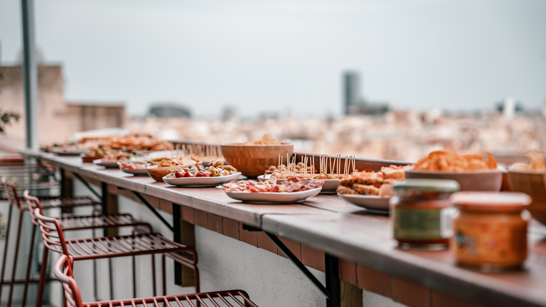 Buffet of snacks on a rooftop terrace